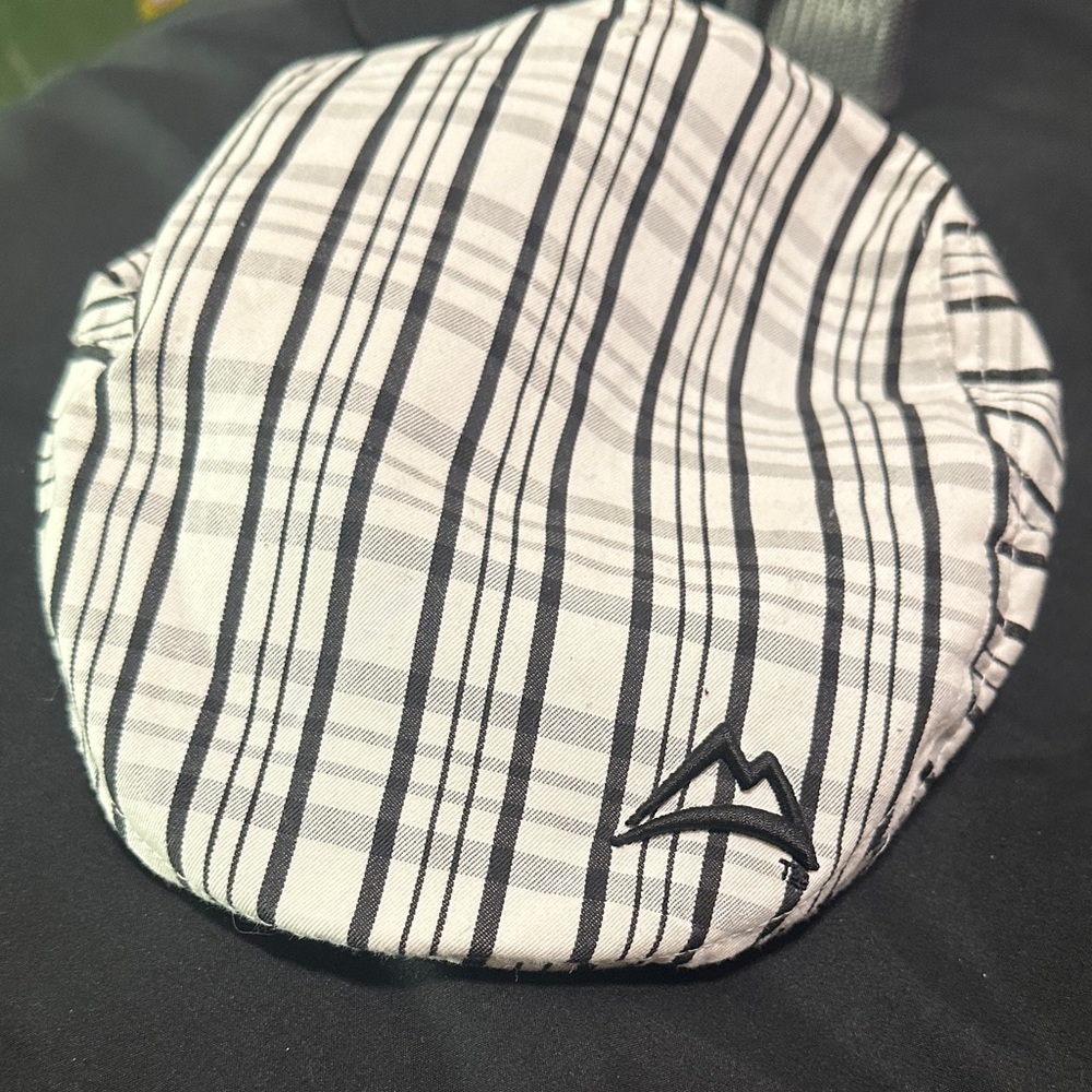 Quagmire Plaid Flat Cap in Black and White Coors light logo.